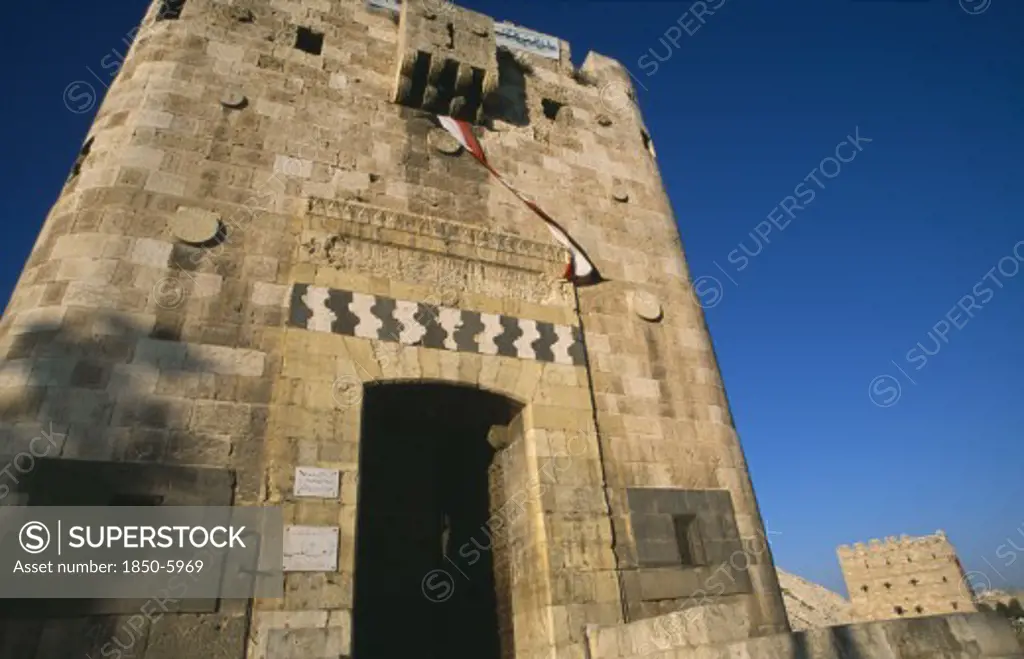 Syria, North, Halab, 'The Citadel. Monumental Gateway, Facade Of Crenellated Tower With Arrow Slits And Decorated With A Horizontal Calligraphic Band Above The Doorway.  '