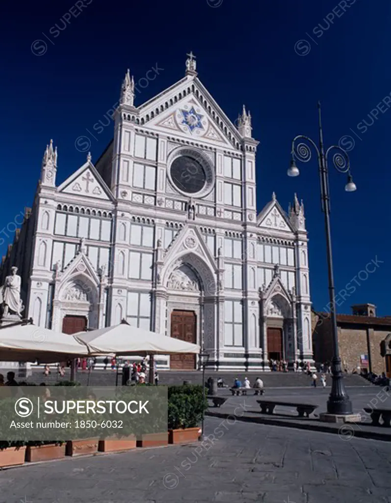 Italy, Tuscany, Florence, Santa Croce Church  Neo-Gothic Facade By Niccol Matas Added In 1863 With People On Steps To Entrance And In Cafe In The Piazza Partly Seen In The Foreground.