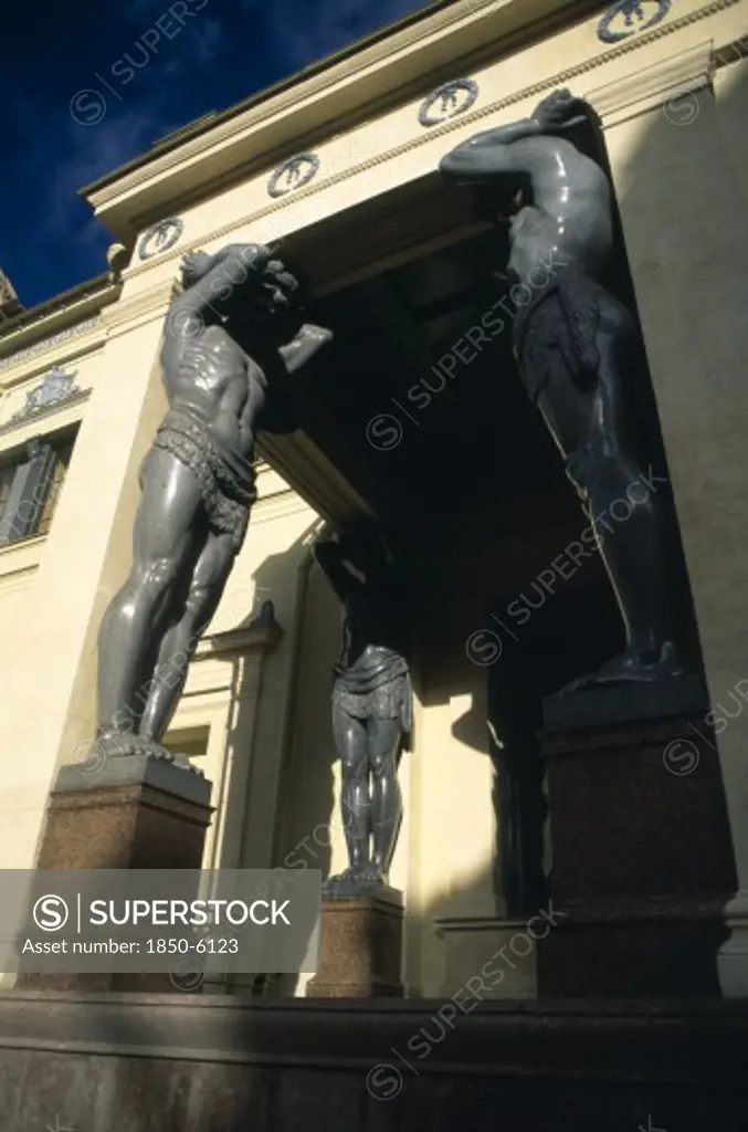 Russia, St. Petersburg, Hermitage Museum.  Angled View Of Old Entrance With Granite Atlantes.