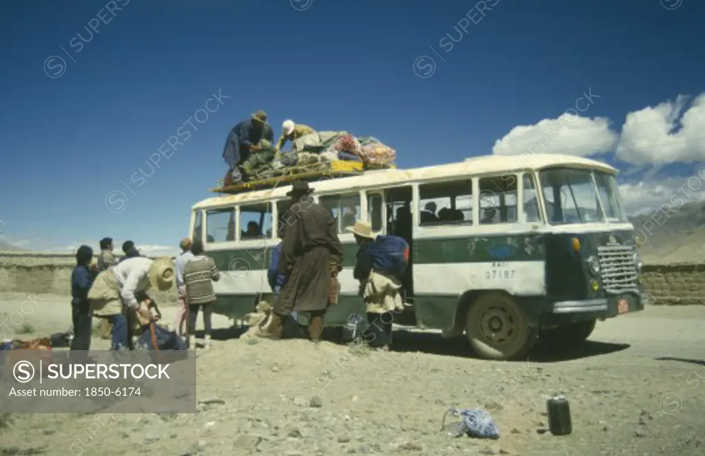 Tibet, Tranport, Bus, Bus In The Countryside Being Loaded With Goods By Passengers