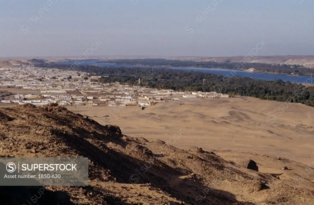 Egypt, Nile Valley, Near Aswan , View Form Hillside Over Nubian Village On The Bank Of The Nile