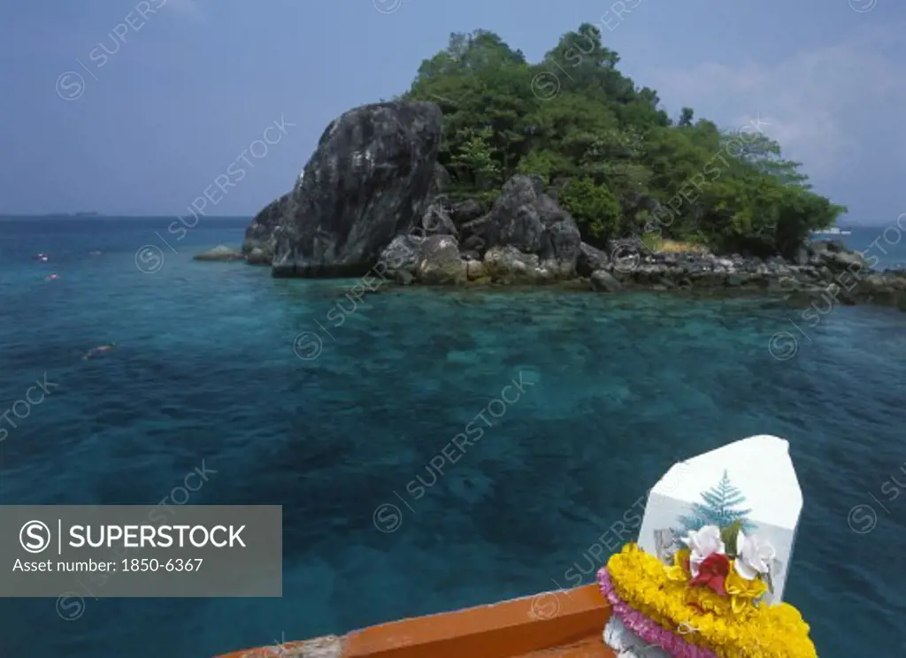Thailand, Trat Province, Koh Chang, 'Tourists Snorkling Over Coral Reefs Near Giant Island, Koh Yang, With Bow Of Boat In Foreground.'