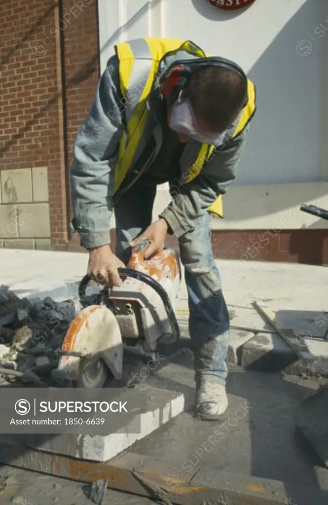 Architecture, Construction, Workman Cutting Pavement Slabs With Angle Grinder