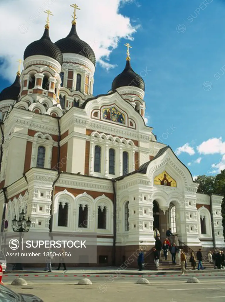 Estonia, Tallinn, Alexander Nevsky Cathedral With People Sitting On Steps At The Entrance.