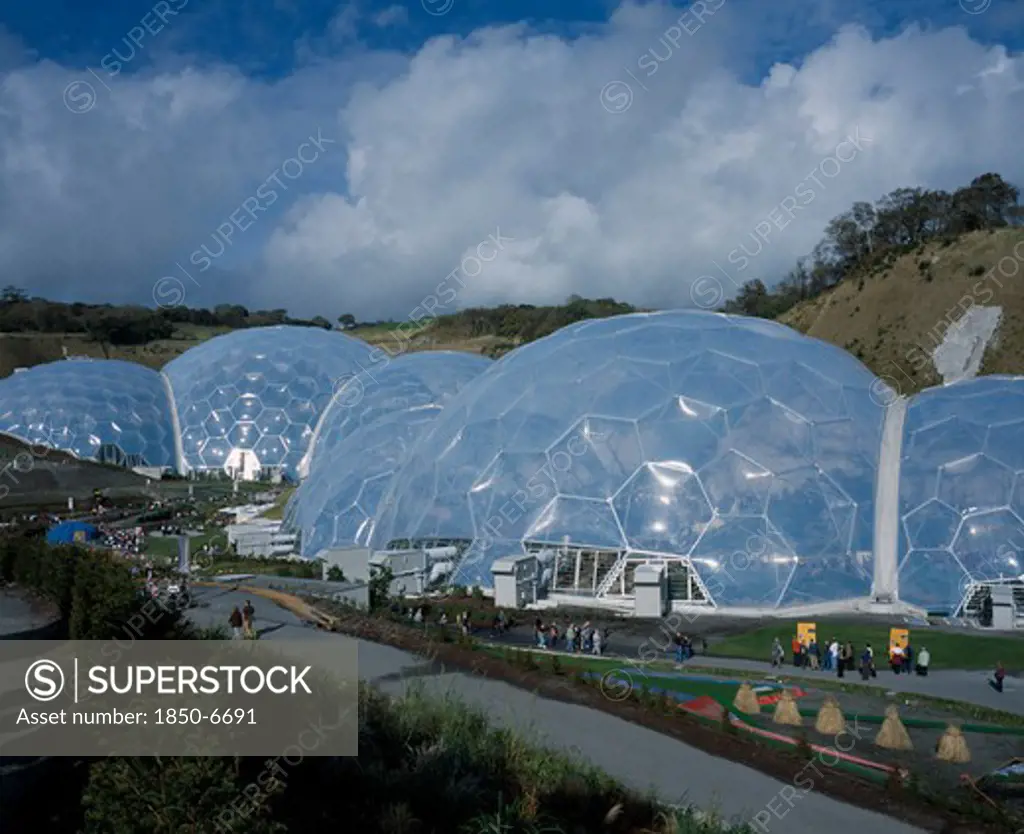 England, Cornwall, St Austell, Eden Project. View Over Temperate Domes With Tropical Domes Behind