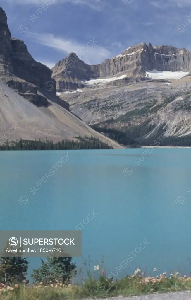 Canada, British Columbia, Jasper National Park, View Over Mountain Lake Toward Rocky Cliffs
