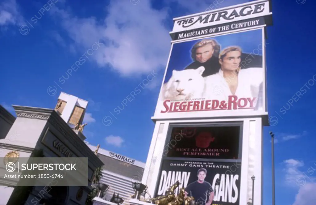Usa, Nevada, Las Vegas, Mirage Hotel And Casino With Signs For CaesarS Palace With Siegfried & Roy In The Foreground