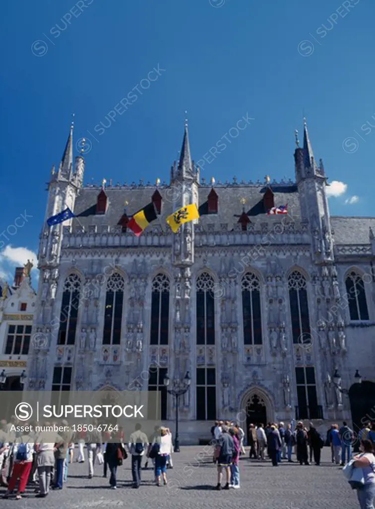 Belgium, West Flanders, Bruges, Tourists Outside The Stadhius In Burg Square.