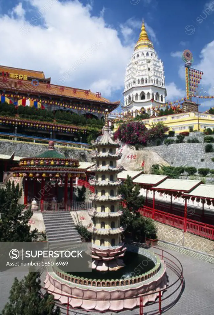 Malaysia, Penang, Kek Lok Si Temple, 'General View Of Temple Complex With Ban Po, The Pagoda Of A Thousand Buddhas In Background And Circular Pond With Seven Tiered Pagoda Sculpture In Centre In Front.'