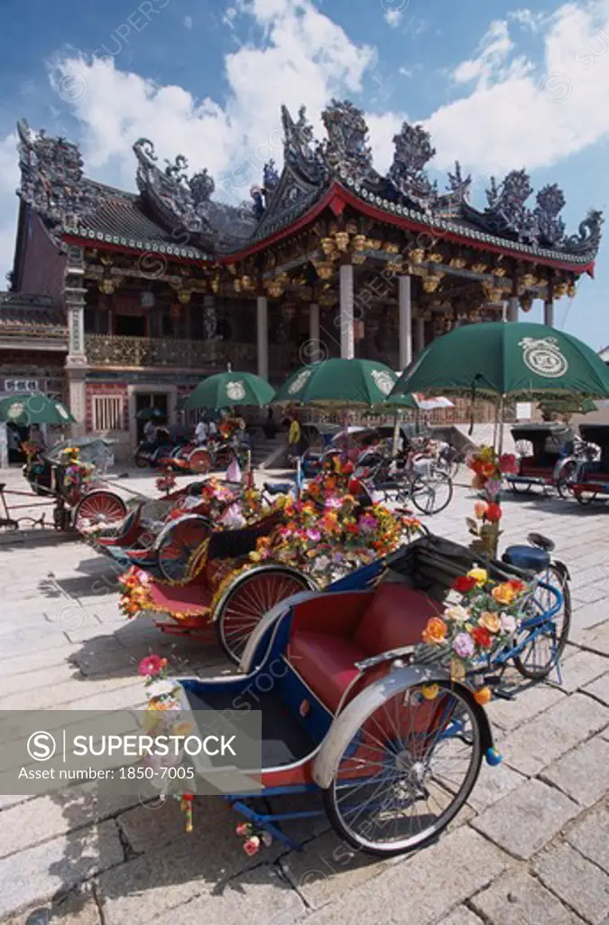 Malaysia, Penang, Georgetown, 'Koo Kongsi, The Dragon Mountain Hall. Exterior Of Clan House With Line Of Decorated Bicycle Rickshaws In The Foreground.'