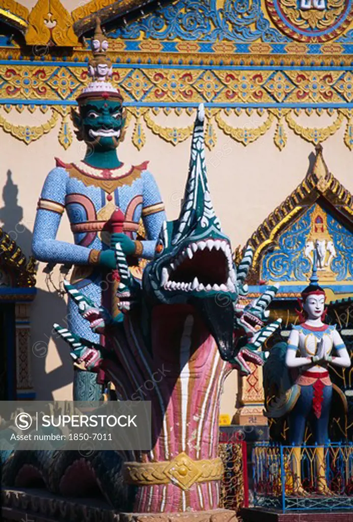 Malaysia, Penang, Georgetown, Wat Chayamangkalaram.  Temple Guardsman And Dragon Statues.