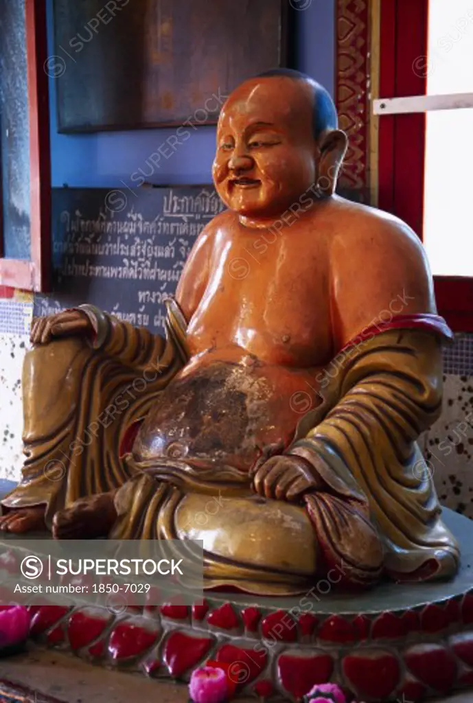 Malaysia, Penang, Georgetown, Wat Chayamangkalaram.  Interior With Laughing Buddha Figure.