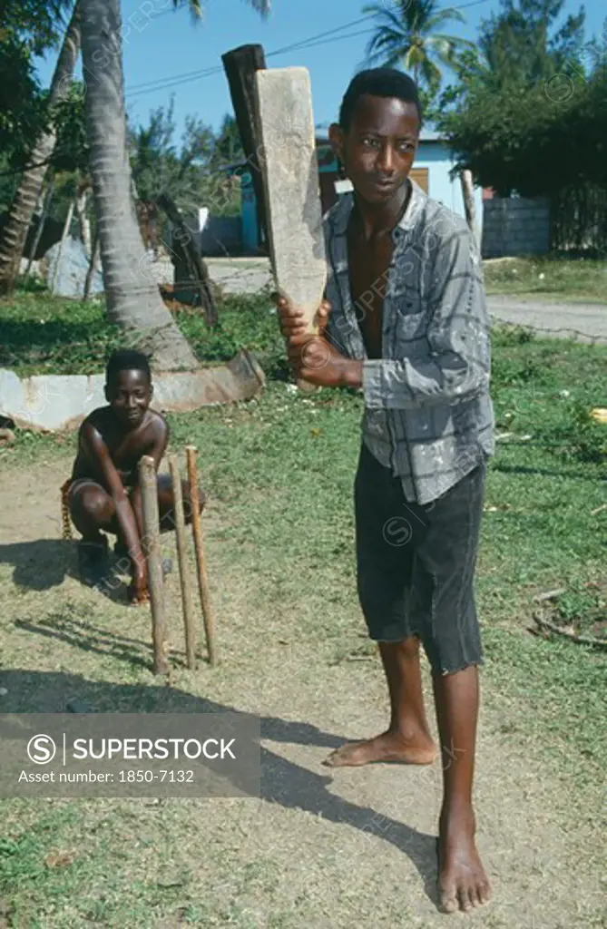 Caribbean, Jamaica, Clarendon, Two Boys Playing Cricket