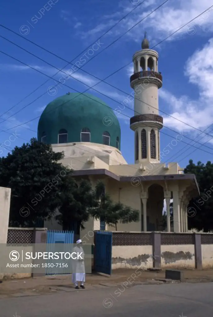 Nigeria, Kano, Mosque With Green Dome. Man Stood Outside The Open Gate.