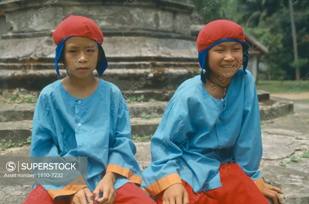 Laos, Luang Prabang, Two Boys In Traditional Dress For New Year