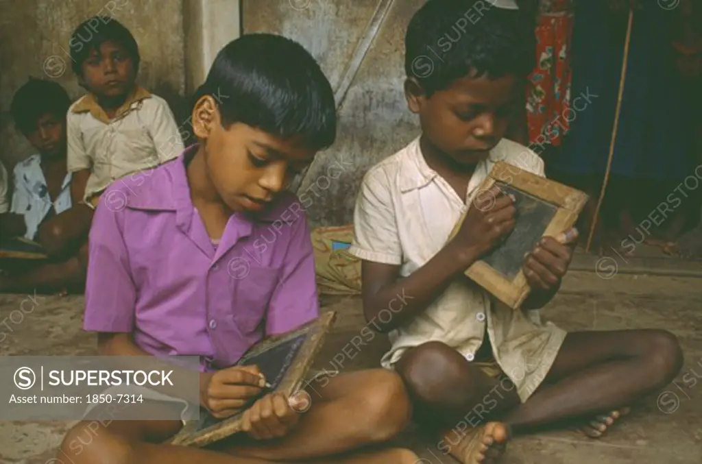India, Gudullur Hills, Education, Tribal Boys At Rural School Writing On Slates.