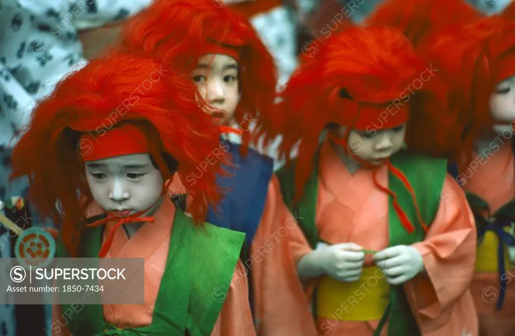 Japan, Honshu, Kyoto, Gion Matsuri With Group Of Children Dressed In Traditional Costume.