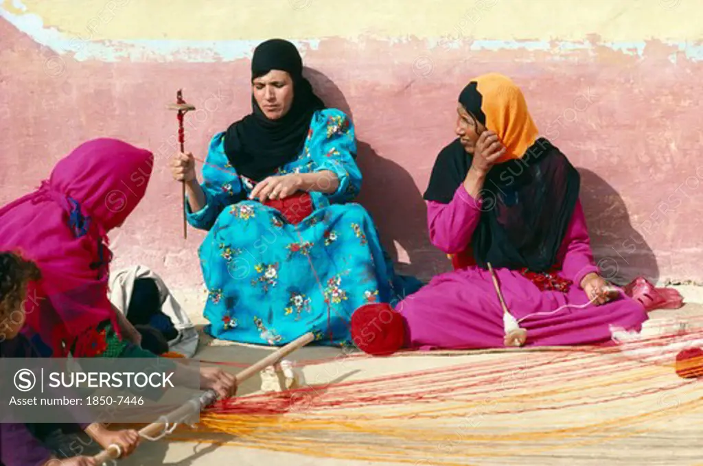 Egypt, West Desert, Bedouin Women Spinning Yarn