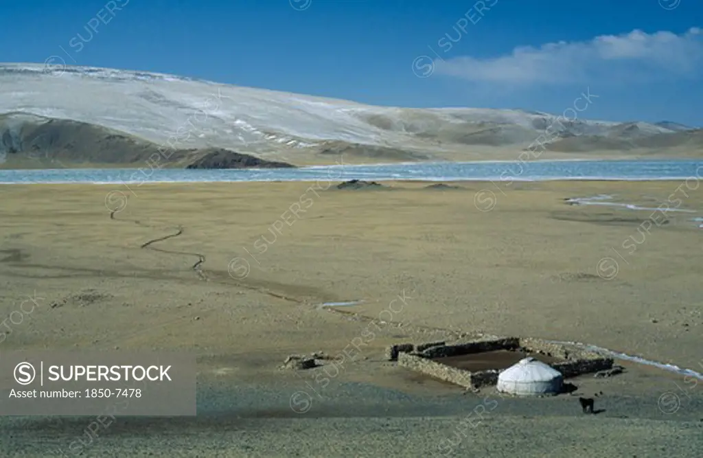 Mongolia, Bayan Olgii Province, View Over Kazakh Nomad Camp With Single Yurt And Surrounding Landscape