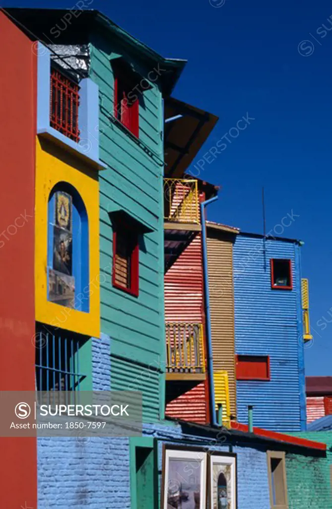 Argentina, Buenos Aires, La Boca.  Brightly Painted Workers Housing.