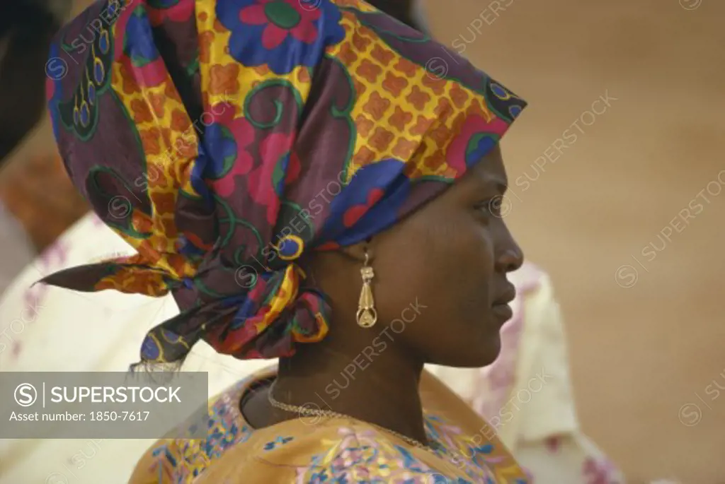 Nigeria, Traditional Dress, Hausa Woman In Traditional Head Dress.  Head And Shoulders Portrait Profile Right.
