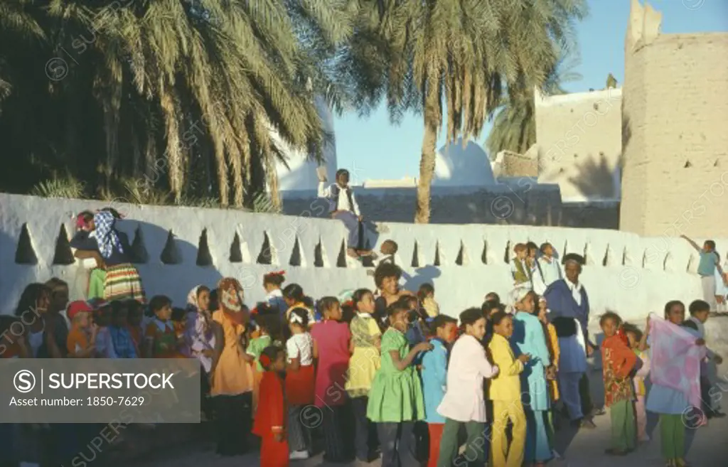 Libya, Gadames, Mixed Crowd In Street.