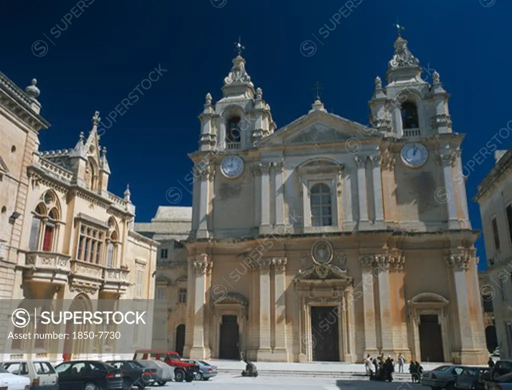 Malta, Mdina, St PaulS Square And Mdina Cathedral. View Of Exterior With Cars Parked In Front.