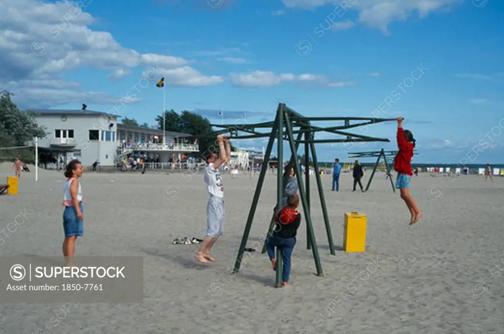 Estonia, Parnu, Children Playing On The Beach.
