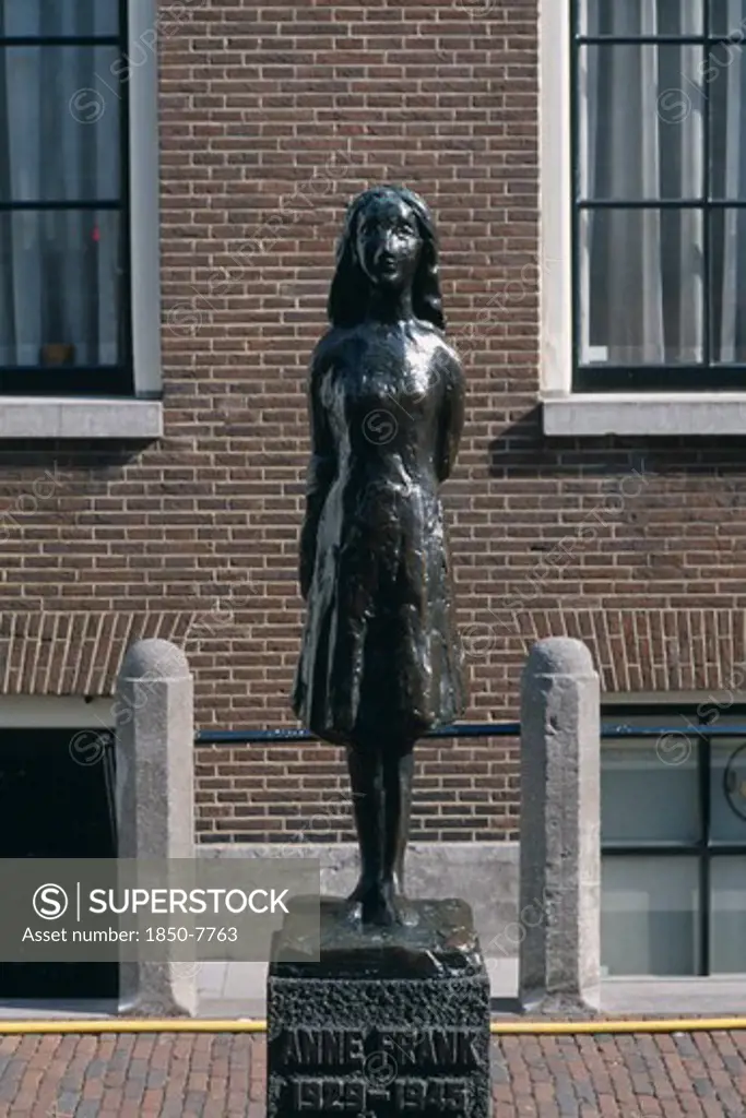 Holland, Noord, Amsterdam, Westermarkt. Statue Of Anne Frank The Young Diary Writer During The Nazi Occupation Of World War Ii