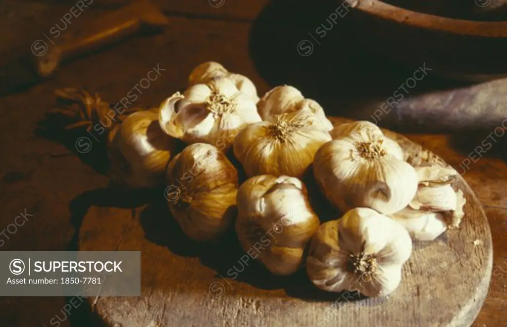 France, Food, Garlic Lying On Wooden Board On Table.