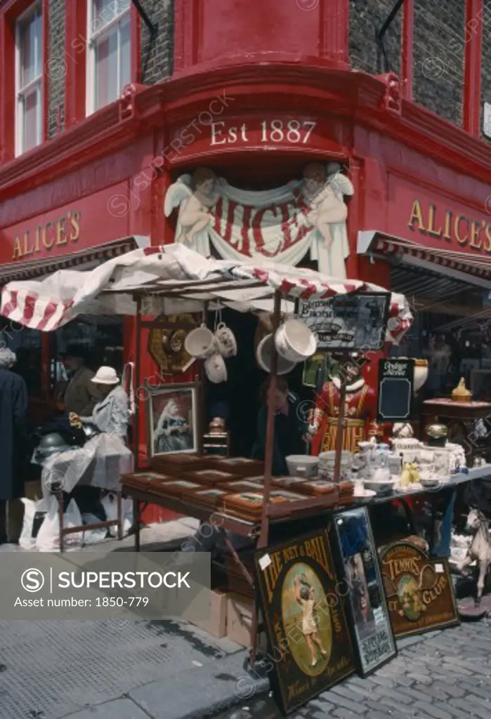 England, London, Portobello Road Antique Shop In The Market With A Stall Outside On The Pavement