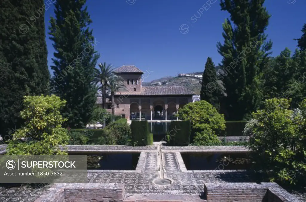 Spain, Andalucia, Granada, Alhambra Palace. The Alcazaba. Jardins De Partal With The Palace Of The Maids In The Background