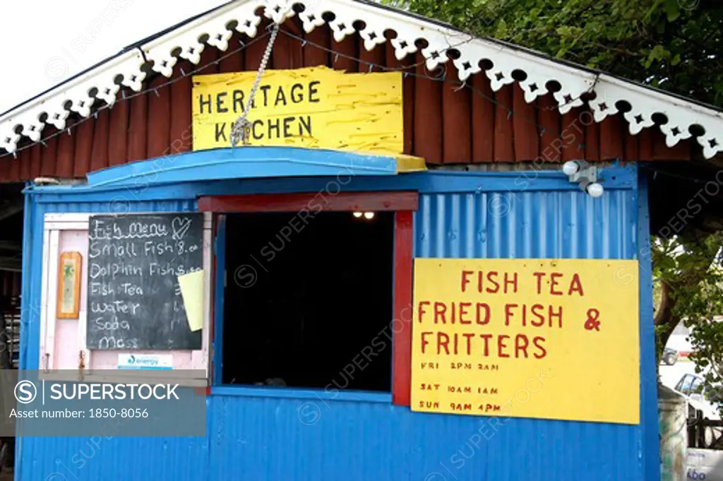 West Indies, Cayman Islands, Fish House With Menu Board Outside Small Opening