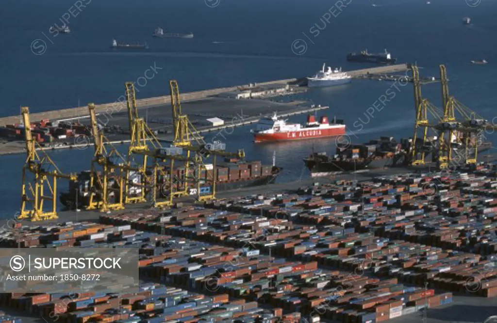 Spain, Catalonia, Barcelona, Container Port With Ships And Cranes.