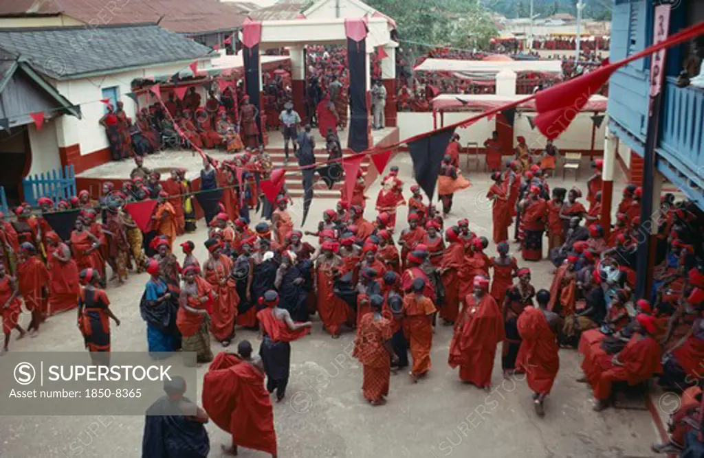 Ghana, People, Ashanti, View Looking Down On Group Of Ashanti People Gathered At A Funeral Dressed In Red The Colour Of Mourning