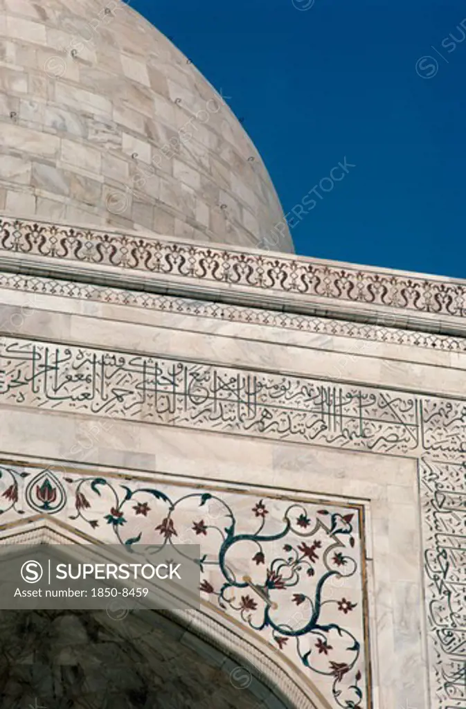 India, Uttar Pradesh, Agra, Detail Of Semi Precious Stones Inlaid In White Marble With Arabic Script Quoting From The Koran On The Taj Mahal