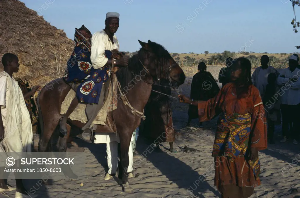 Chad, Wedding, Arranged Marriage Mock Abduction With Fourteen Year Old Bride Taken Away On Horseback By Her New Husband To His Village.