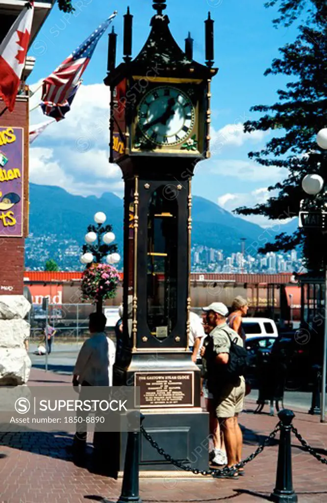 Canada, Vancouver, Gastown, The Gastown Steam Clock With People Reading The Inscriptions Around The Base