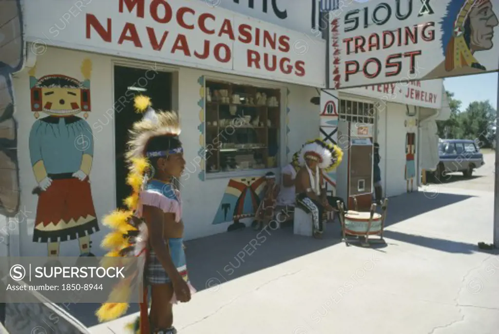 Usa, Indigenous People, Native American Indian Man And Boy In Costume Outside Sioux And Navajo Trading Post