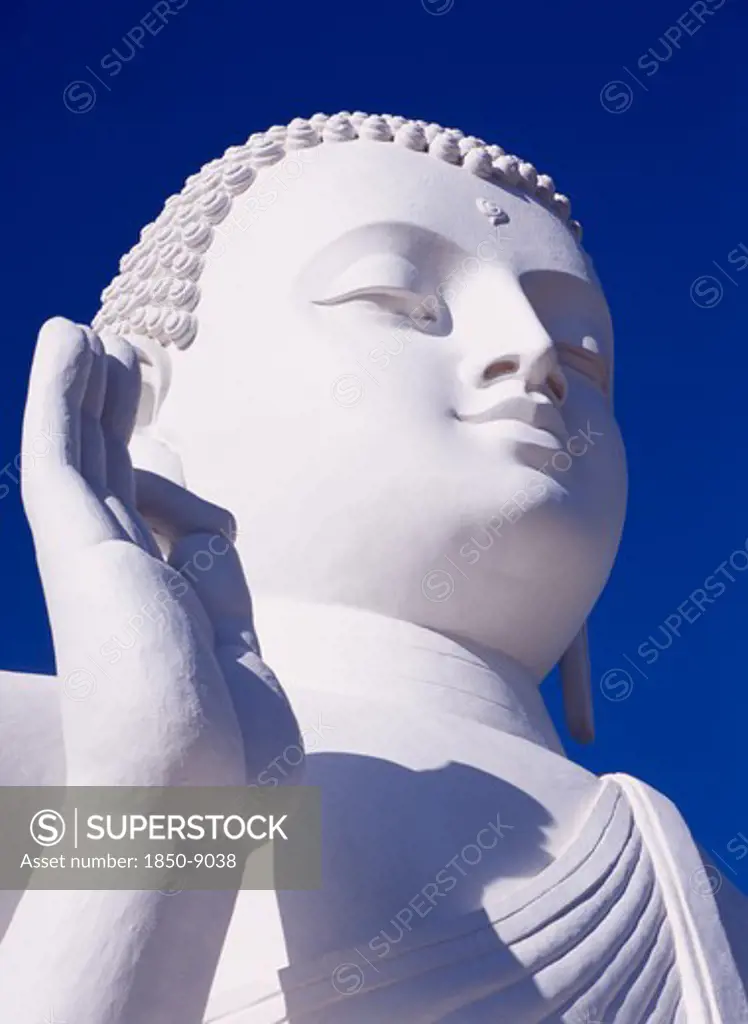 Sri Lanka, Mihintale, Large White Seated Buddha.  Angled Detail Of Head And Raised Hand.