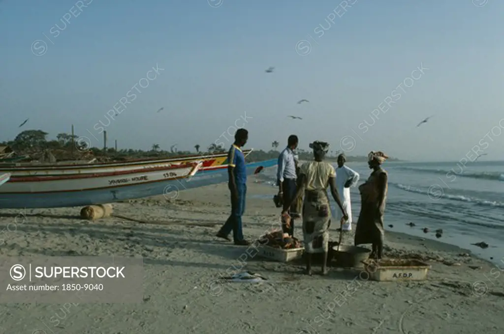 Gambia, Gunjar, People Buying Freshly Caught Fish On The Beach