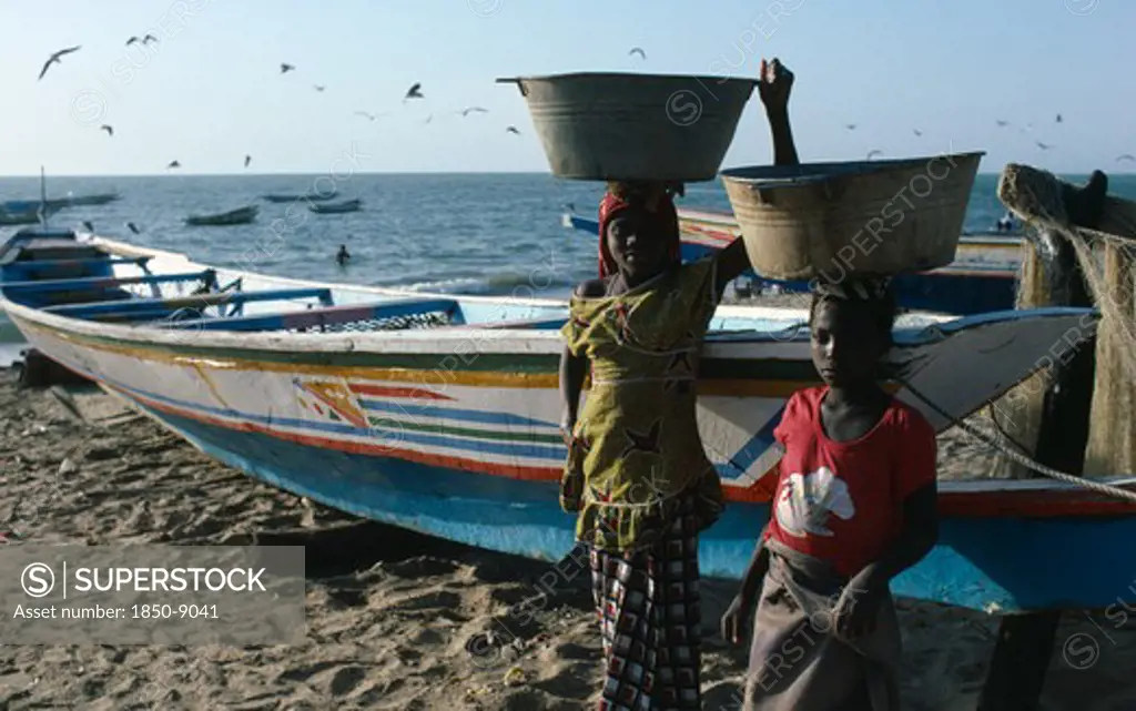 Gambia, Fishing, Girls Carrying Buckets Of Fish On Their Heads