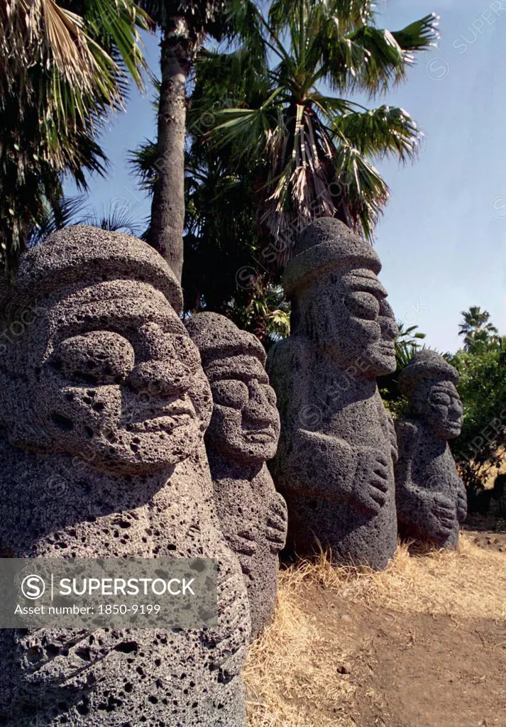 South Korea, Cheju Do Island, Tolharubang Grandfather Stones Carved From Lava Rock Which Are Guardians Of The Gates To Chejus Ancient Towns