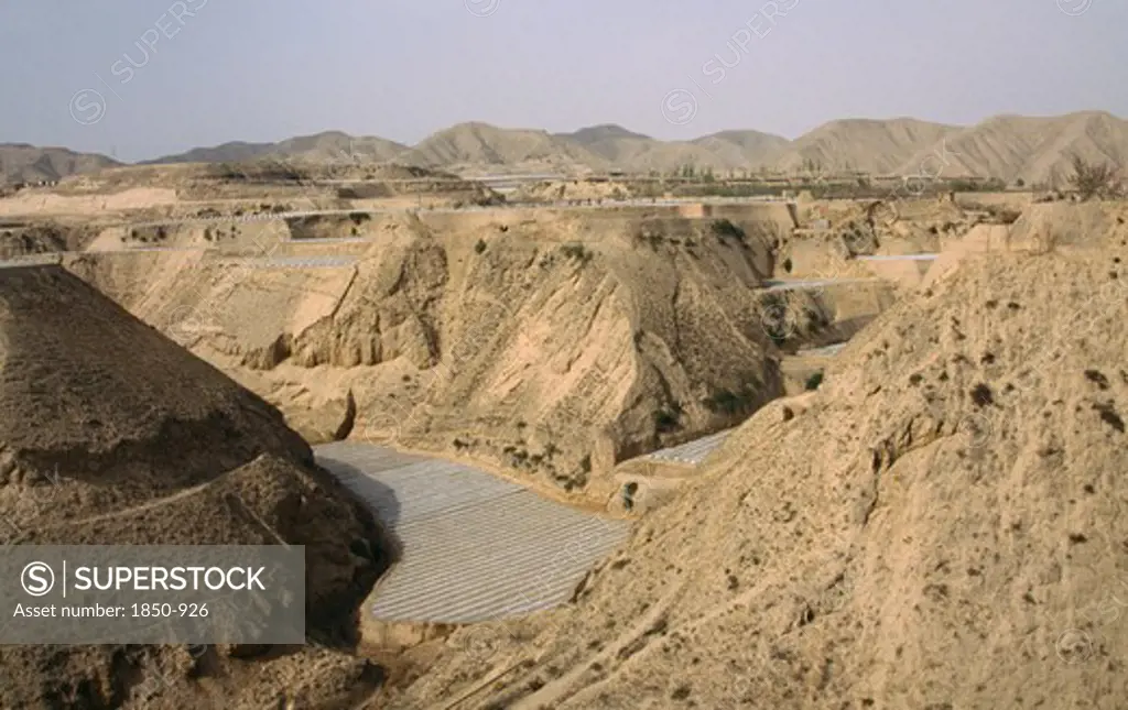 China, Gansu, Loess Scenery Near The Yellow River Showing Farming Under Polythene Tunnels