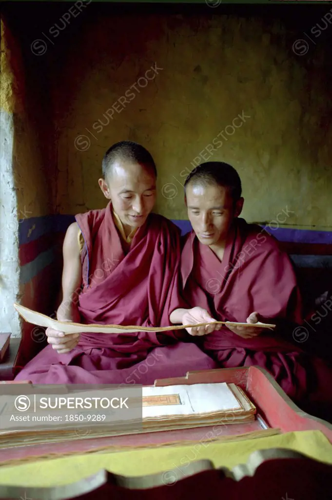 China, Tibet, Ganden Monastery, Monks Reading Scriptures