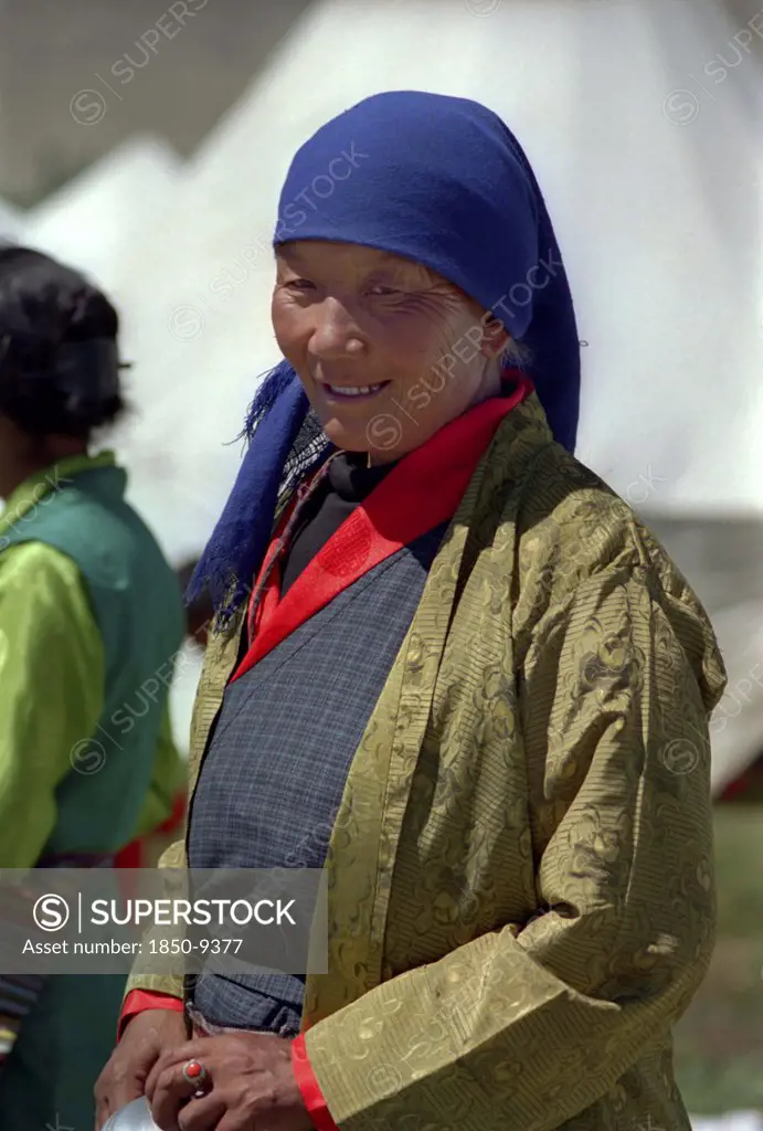 India, Ladakh, Portrait Of Female Pilgrim At The 14Th Dalai Lamas Birthday Celebrations