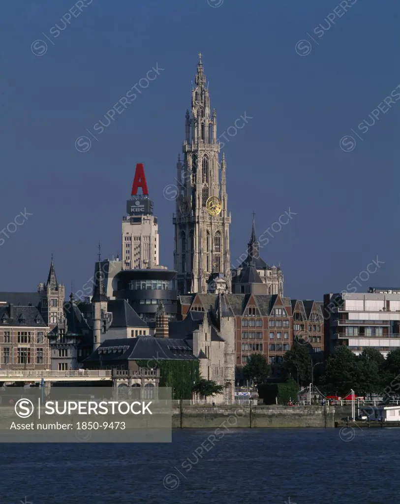 Belgium, Flemish Region, Antwerp, Cathedral Of Notre Dame From Across The River Scheldt With The Torengebouw And Steen Castle.