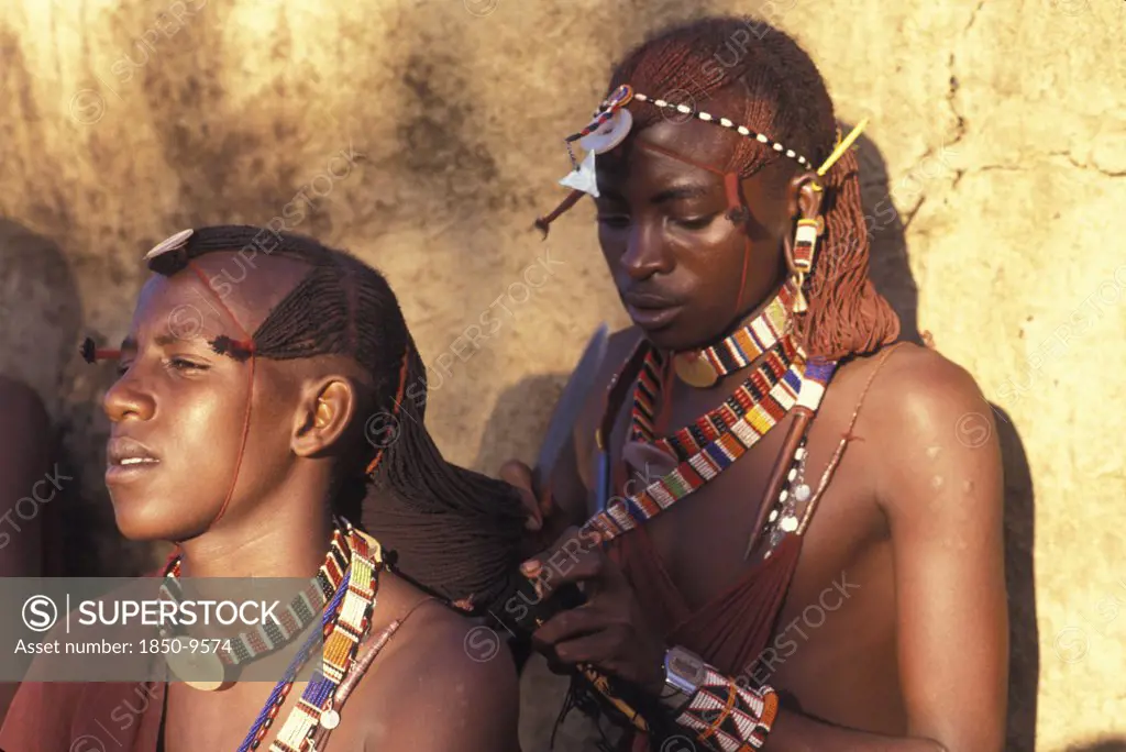 Kenya, , Maasai Moran Platt Each Others Hair Prior To An Initiation Ceremony That Will Take Them Into Manhood. The Moran Live In Age Sets Being Brought Up Together Like Brothers.