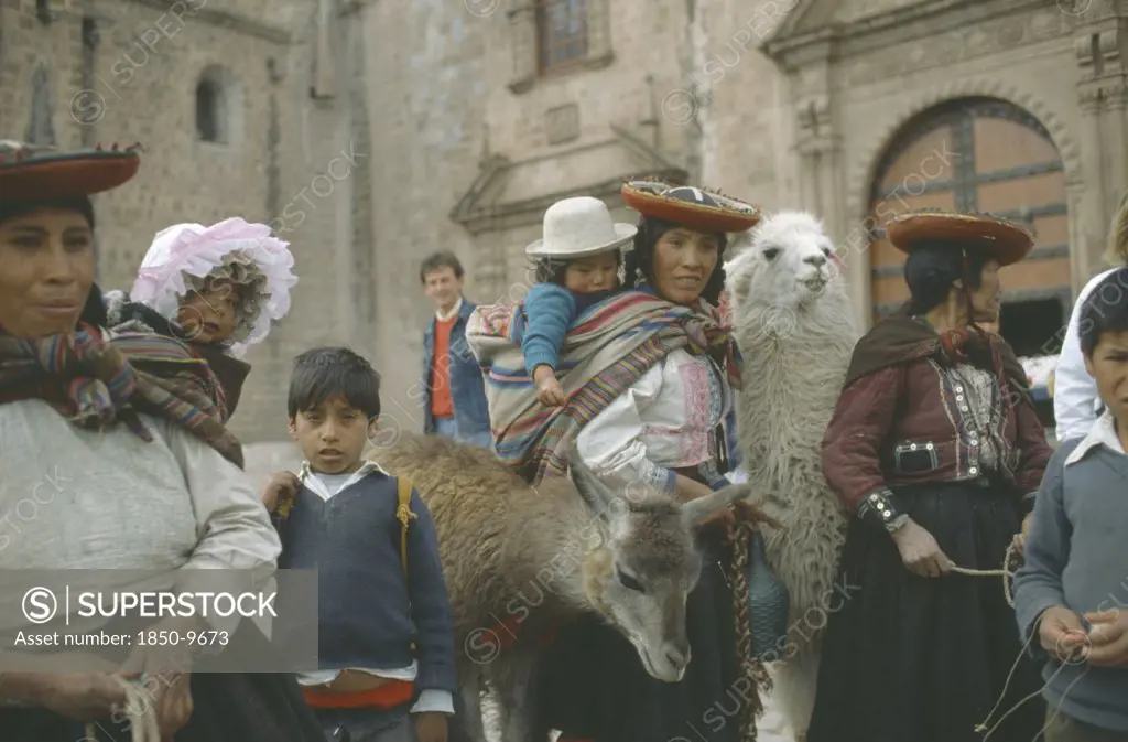 Peru, Cuzco, Quechua Women And Children With Lamas.