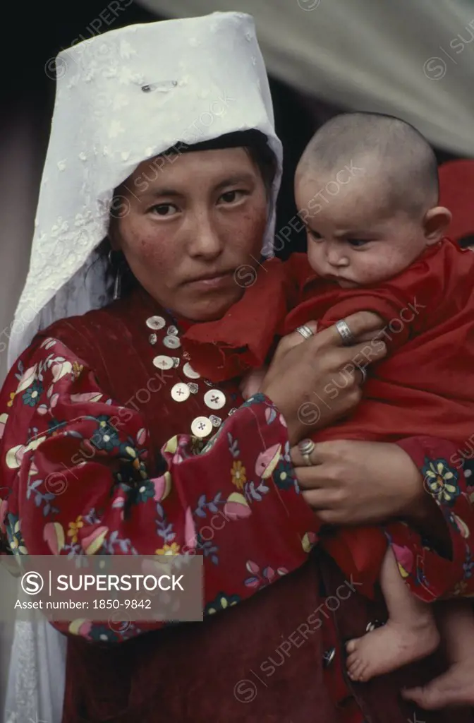 Afghanistan, People, Portrait Of Kirghiz Woman Holding Baby.